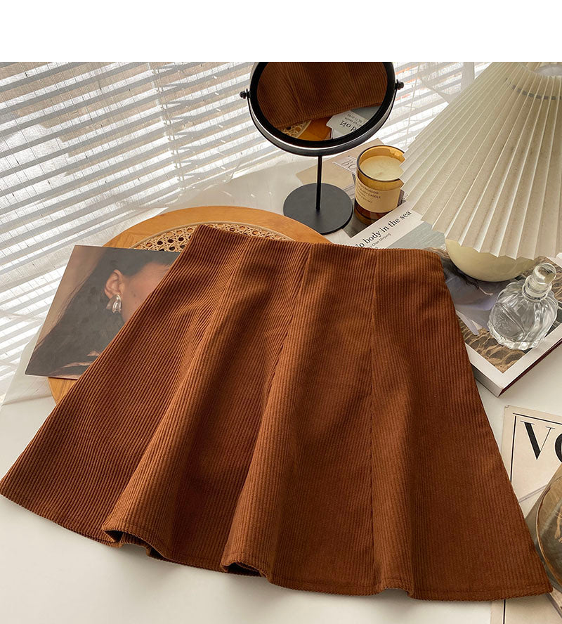 Foreign style leisure solid color high waist A-line umbrella skirt short skirt 5575