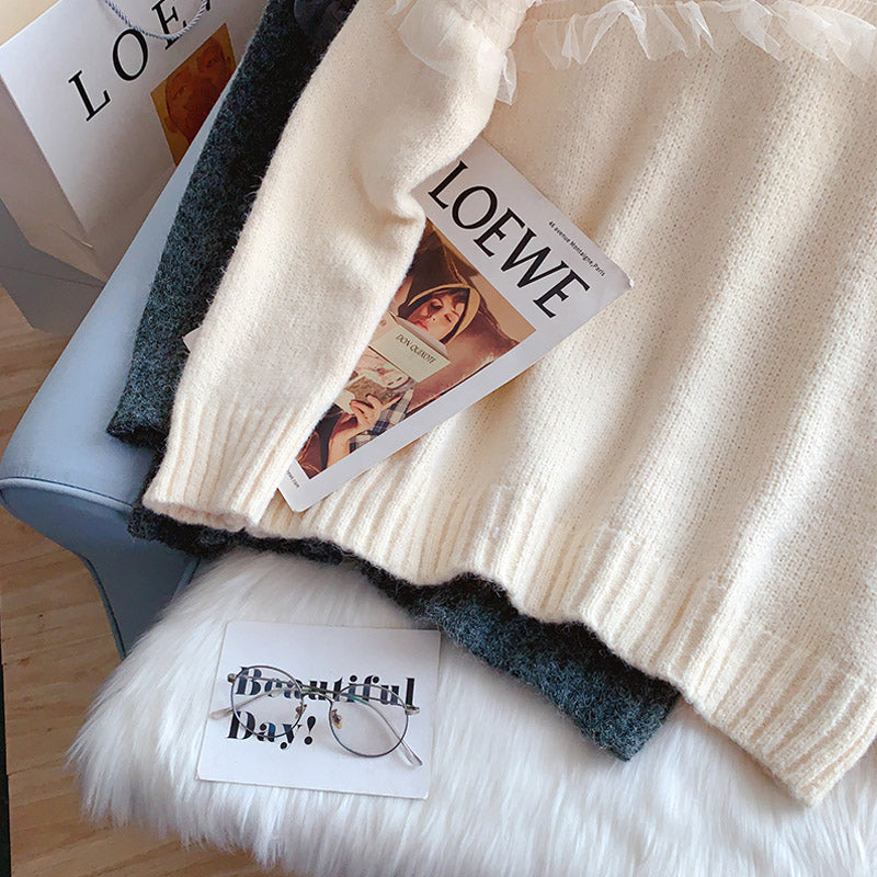 Temperamentvoller Pullover mit Spitzenstickerei und Rundhalsausschnitt 5258