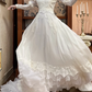 Ivory Vintage Tulle Wedding Prom Dress, Lace High Neck Illusion V‑Neck, Leg‑of‑Mutton Puff Sleeves, Lace Appliqués, Multi‑Tier Ruffle Cake Skirt gh8677