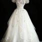 Off‑the‑Shoulder Ball Gown Wedding Dress, Puff Short Sleeve Corset Bodice 3D Purple Floral Applique Ruffled Satin‑Trim Tulle Skirt Bridal Gown gh9117