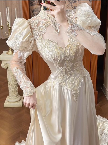 Champagne Vintage Satin Wedding Gown, Illusion Lace High Neck Over Sweetheart Neck, Puff Shoulder Lace Long Sleeves, Gold‑Thread Lace Appliqué Pointed Waist, A‑Line Satin Long Train With Ruffle Lace Hem, Prom Dress gh8651