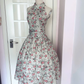 Vintage Halter Neck Floral Midi Dress, Sleeveless Off‑Shoulder High Halter Collar Wide Waistband Full Pleated Swing Skirt Rose Print Cocktail Gown gh9087