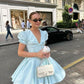 Girlhomeshops - Robe de soirée courte en satin bleu clair à col en V et manches bouffantes, style trapèze, tenue d'anniversaire, gh5289
