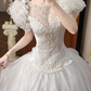 White Vintage Tulle Wedding Ball Gown, Tassel Fringe Illusion Round Neck Over Sweetheart Neck, 3D Floral Ruffle Puff Short Sleeves, Heavy Beaded Lace Appliqué Bodice, Voluminous A‑Line Tulle Skirt With Multi‑Layer Ruffle Hem, Prom Dress gh8655