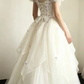 Off‑the‑Shoulder Ball Gown Wedding Dress, Puff Short Sleeve Corset Bodice 3D Purple Floral Applique Ruffled Satin‑Trim Tulle Skirt Bridal Gown gh9117