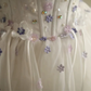 Off‑the‑Shoulder Ball Gown Wedding Dress, Puff Short Sleeve Corset Bodice 3D Purple Floral Applique Ruffled Satin‑Trim Tulle Skirt Bridal Gown gh9117