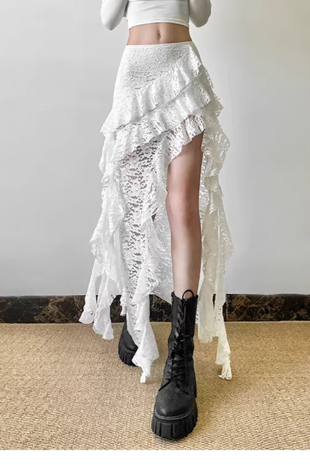 Pure and alluring textured high-waisted midi skirt with ruffled hem, slimming and asymmetrical design.  11460