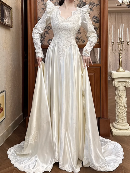 Ivory Vintage Satin Wedding Gown, V‑Neck 3D Bow Puff Shoulders, Lace Embroidered Long Sleeves, Lace Appliqués Fitted Waist, A‑Line Long Train With Scalloped Lace Hem, Prom Dress gh8665