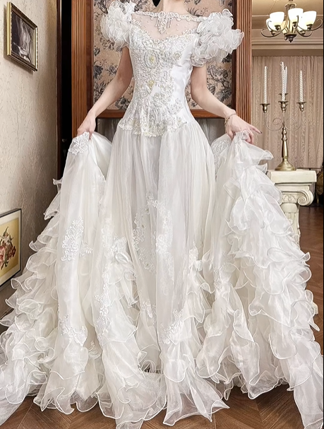 White Vintage Tulle Wedding Ball Gown, Tassel Fringe Illusion Round Neck Over Sweetheart Neck, 3D Floral Ruffle Puff Short Sleeves, Heavy Beaded Lace Appliqué Bodice, Voluminous A‑Line Tulle Skirt With Multi‑Layer Ruffle Hem, Prom Dress gh8655