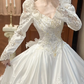 White Vintage Satin Ball Gown Wedding Prom Dress, V‑Neck, 3D Floral Shoulders, Leg‑of‑Mutton Long Sleeves, Multi‑Tier Ruffled Cake Skirt gh8685