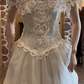 Ivory White Vintage Wedding Gown, Off‑the‑Shoulder 3D Floral Neckline Spaghetti Strap Fitted Pointed Bodice Satin A‑Line Bridal Dress gh9077