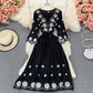 Jolie robe brodée coupe A 639