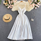 Robe trapèze blanche à col en V et à la mode 574