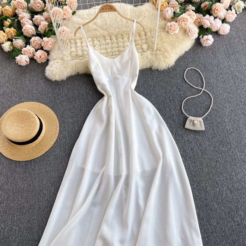 Robe trapèze blanche à col en V et à la mode 574