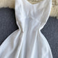 Robe trapèze blanche à col en V et à la mode 574
