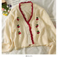 Pull à carreaux en losanges brodés de cerises et à bords ondulés 1748
