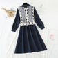 The New Retro waistband is slim, and the two-piece waistcoat skirt is over the knee  2195