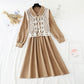 The New Retro waistband is slim, and the two-piece waistcoat skirt is over the knee  2195
