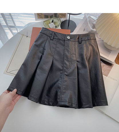Koreanischer dünner modischer altersreduzierender Faltenrock aus Leder mit hoher Taille 5461