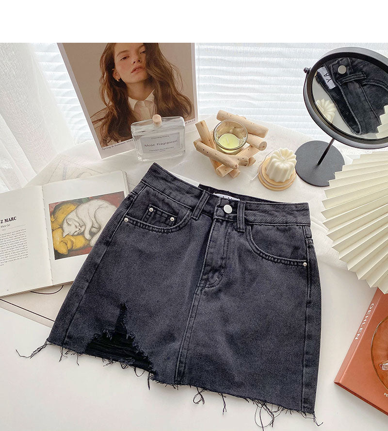 Korean version light proof personalized hole breaking high waist A-shaped skirt  5567