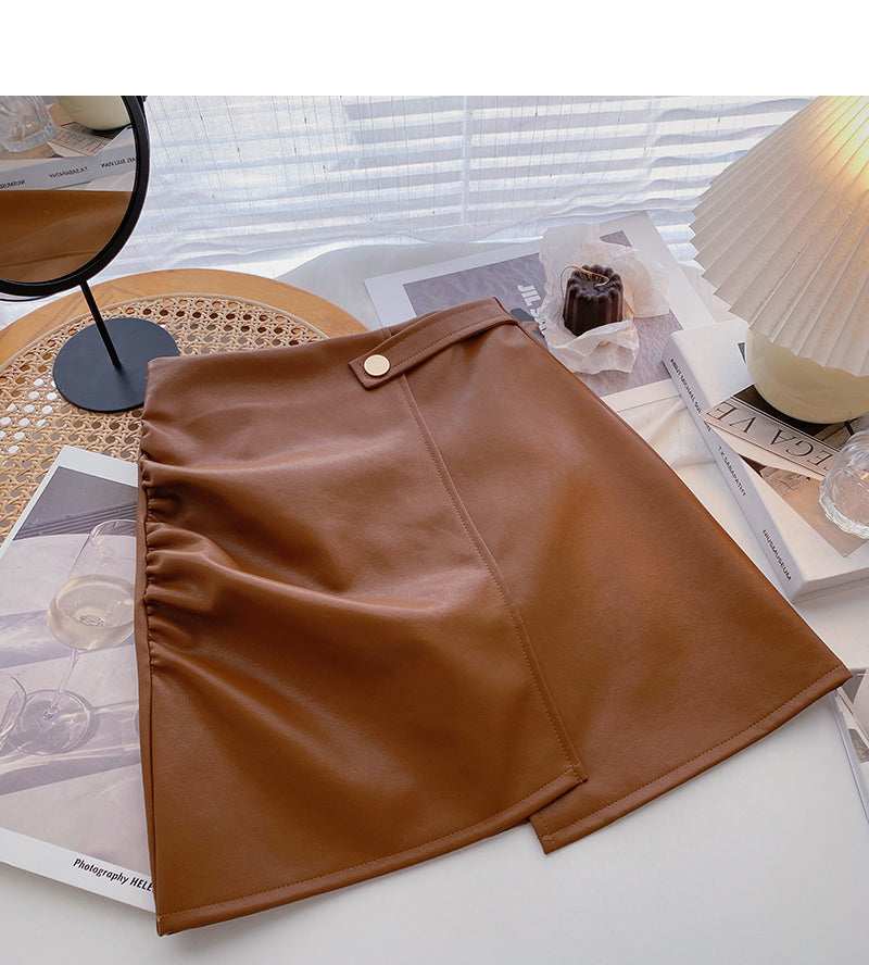 Koreanischer zerknitterter Hip Wrap unregelmäßiger dünner A-förmiger PU-Lederrock mit hoher Taille 5591