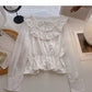 Chemise à lacets, col rond et volants, taille fine 6434