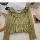 Chemise à lacets, col rond et volants, taille fine 6434