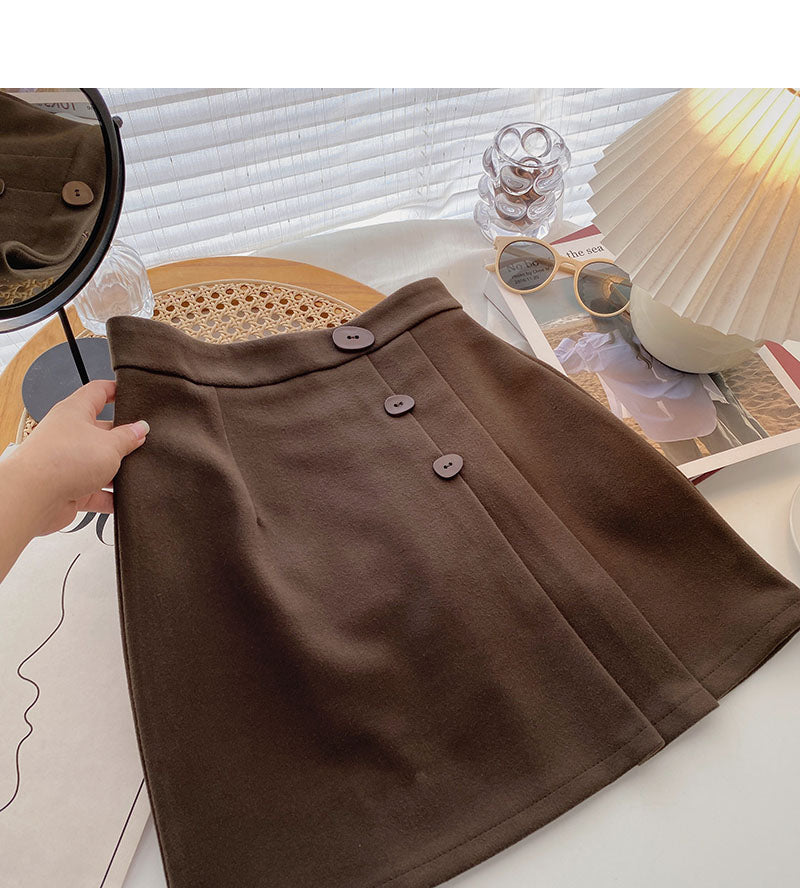 Drei-Knopf-Design mit hoher Taille, ausländischer Stil, altersreduzierender Faltenrock in A-Linie 5442