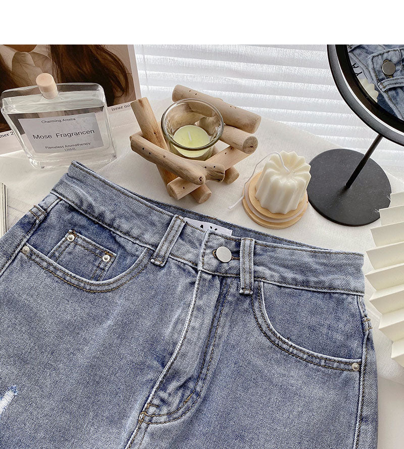 Korean version light proof personalized hole breaking high waist A-shaped skirt  5567