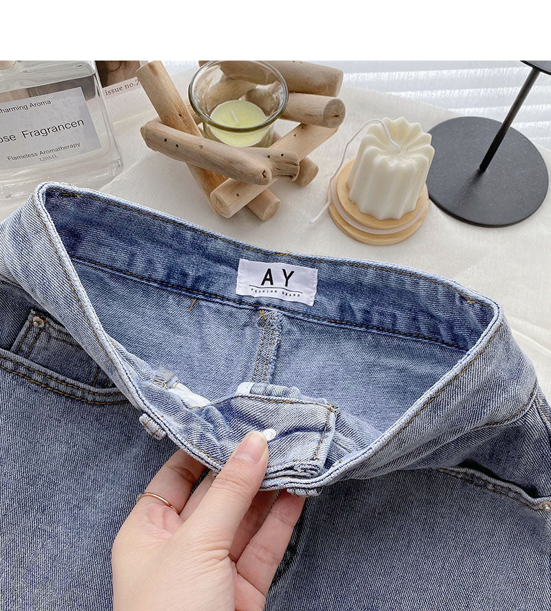 Korean version light proof personalized hole breaking high waist A-shaped skirt  5567