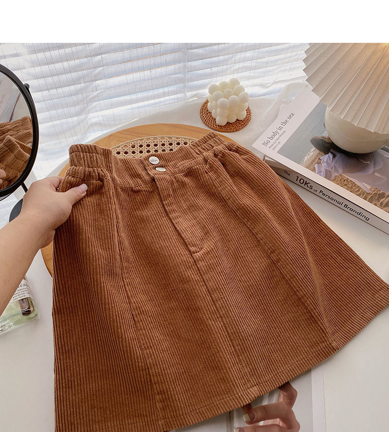 Nouvelle jupe coréenne en forme de A anti-lumière taille haute slim de couleur pure 5417