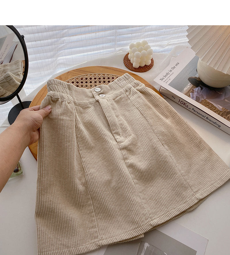 Nouvelle jupe coréenne en forme de A anti-lumière taille haute slim de couleur pure 5417